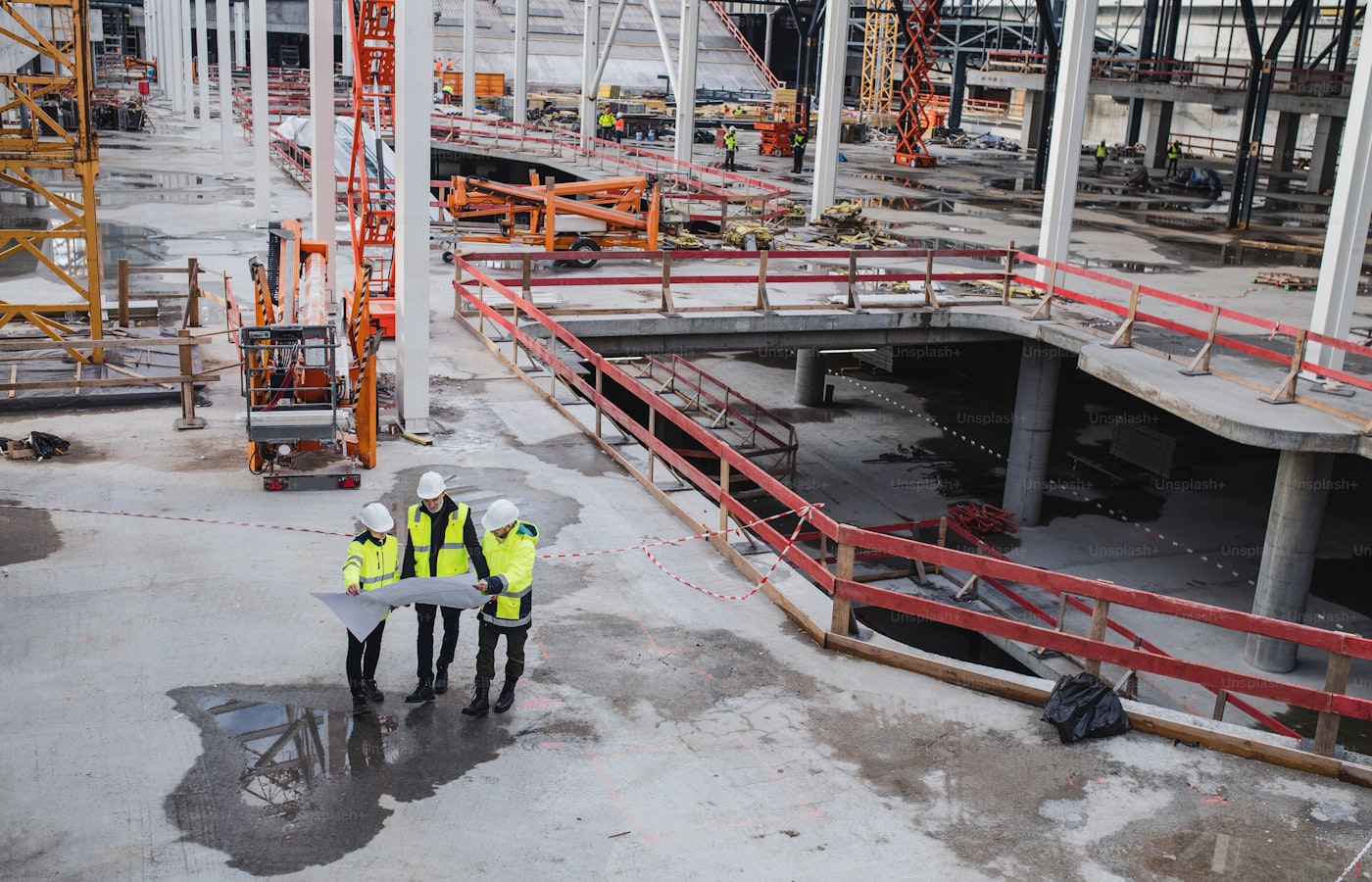 Engineers reviewing plans together on a construction site